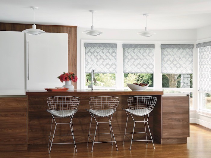 A kitchen island with sink and counter.